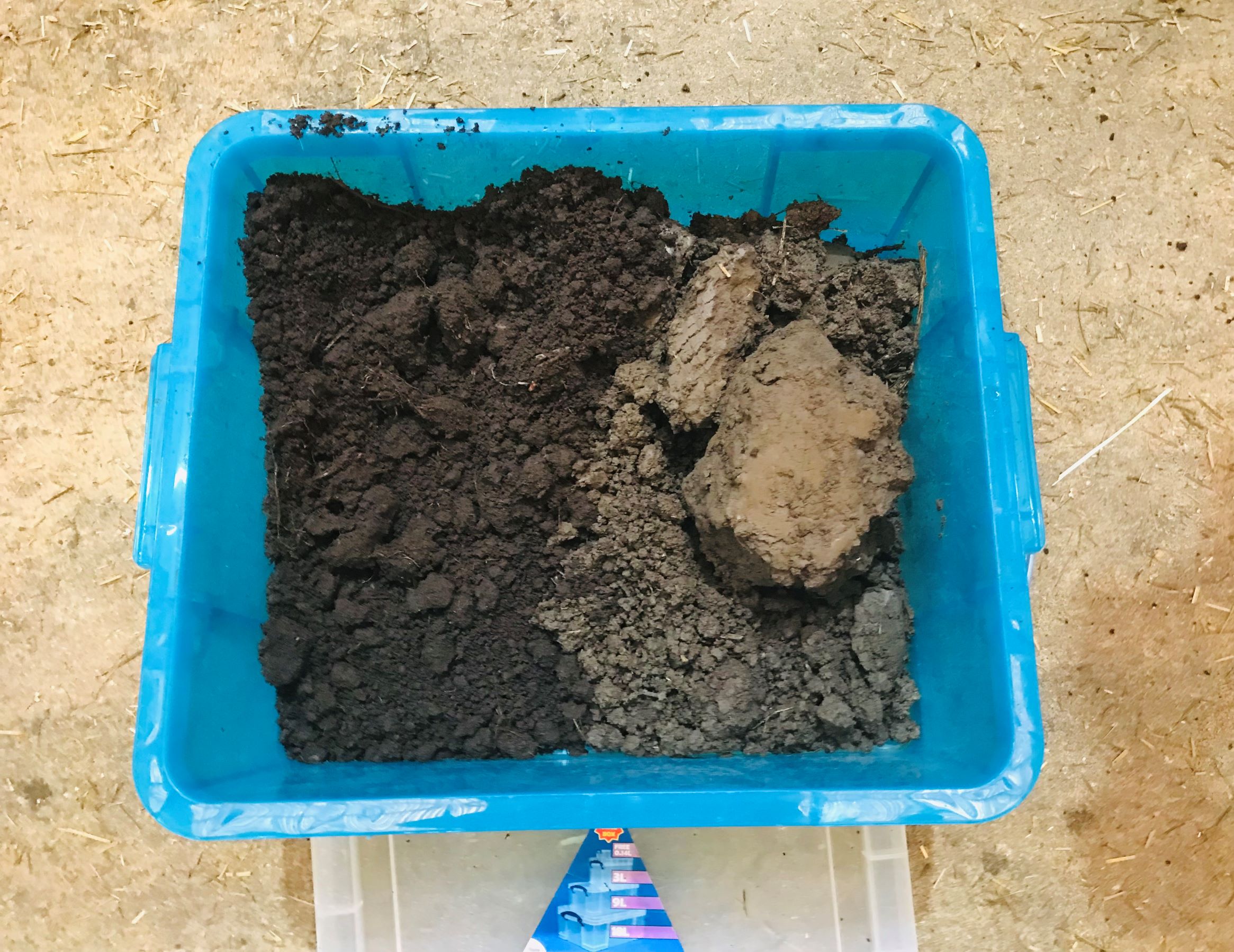 Two different types of soil in container